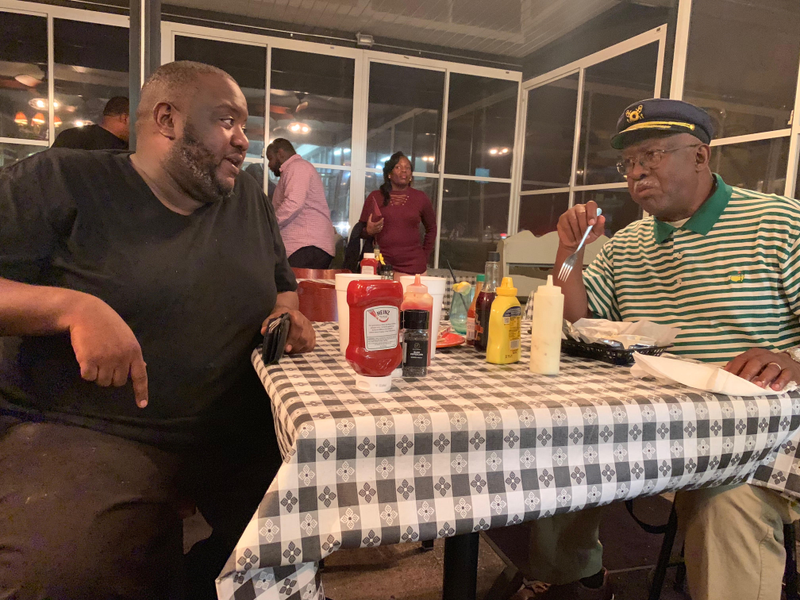 Glenn Singfield, Jr., left, and Glenn Singfeild, Sr., right, talking about Stacey Abrams on Saturday, Nov. 3, 2018.